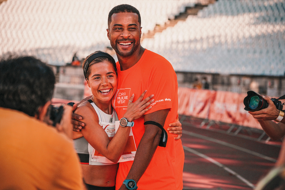 Two runners moving through a race together